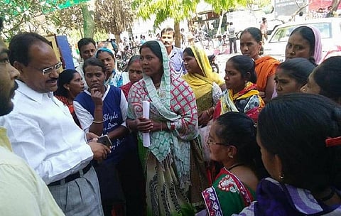 Women presenting their demands to the elected ward of their district. UHRC