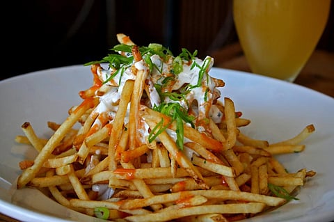 Trans fats are present in partially hydrogenated vegetable fats that are used to produce snacks and fried foods. Credit: Wikimedia Commons