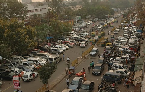 A street with parked vehicles in Delhi Credit: Anumita Roychowdhury