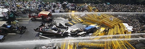 Police open water cannons on protesting farmers at Delhi-UP border on Tuesday. Credit: Vikas Choudhary