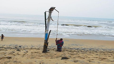 A Satabhaya resident says the Bay of Bengal has swallowed up 10 tube wells in their village in the past two decades. (Credit: Ashis Senapati)