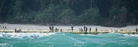 Sentinelese gathered on a beach of their home island. Credit: Survival International