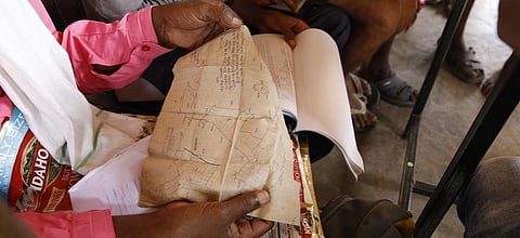 Residents of Belar village verify their land titles at the panchayat office. Photos: Vikas Choudhary