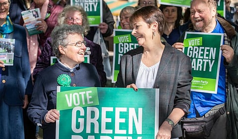 Catherine Rowett (left) with other Green Party, UK, members during a rally. Photo: Joseph Casey Photography