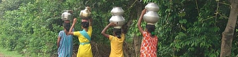 Women in rural India walk over 1.5 km to fetch drinking water. Photo: Salahuddin