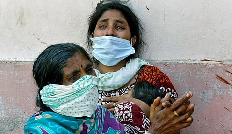 Women outside a mortuary to receive the body of a relative who died after the gas leak at the LG Polymers plant in Visakhapatnam on May 8; Photo: Reuters