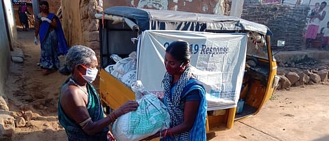 An old woman in Madhaympur village under Belpada block of Balangir being provided with a nutrition kit. Photo: Priya Ranjan Sahu