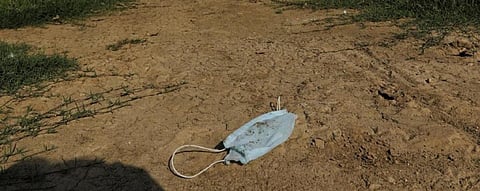 An improperly disposed off face mask lies near India Gate, Delhi during the nationwide lockdown to curb the spread of the novel coronavirus disease (COVID-19) pandemic Photo: Vikas Choudhary