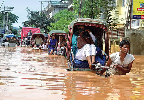 Bharalu river’s ability to carry excess rainwater to the Brahmaputra has reduced because people use it as a dumping ground for garbage (Photographs: Manash Das)