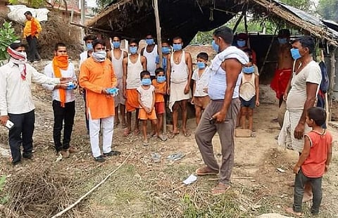 Bharatiya Janata Party Workers distributing masks and sanitisers in UP's Barabanki and Ghazipur districts. Photo: @BJP4UP / Twitter