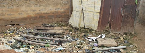 Filled-up drop hole toilets in Passo village, Nigeria. Photo: Newsan