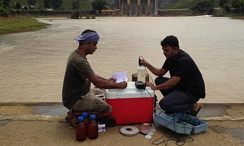 Researchers collecting water samples