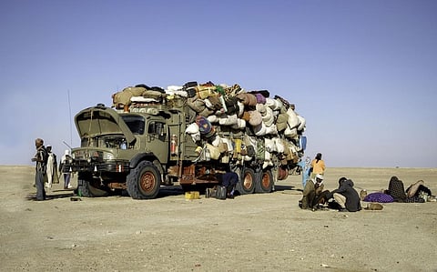 A truck filled with migrants breaks down in the Sahara in Chad. Photo: istock