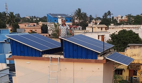 BK Bahinipati, a ‘prosumer’, with solar panels on his roof in Bhubaneswar. Photo: Rakhi Ghosh