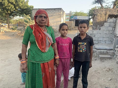 Hastu Devi with the two orphaned children she adopted. Photo: Himanshu Nitnaware