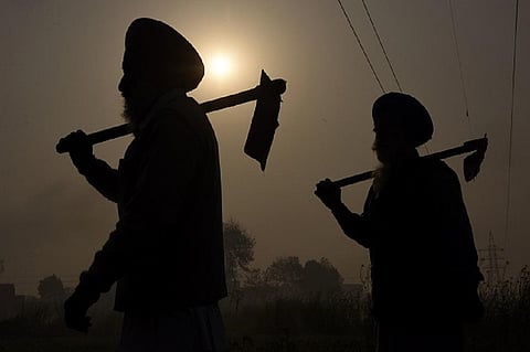Farmers in India are among communities around the world hit hard by unscrupulous microlending. Photo: Narinder Nanu / AFP via Getty Images