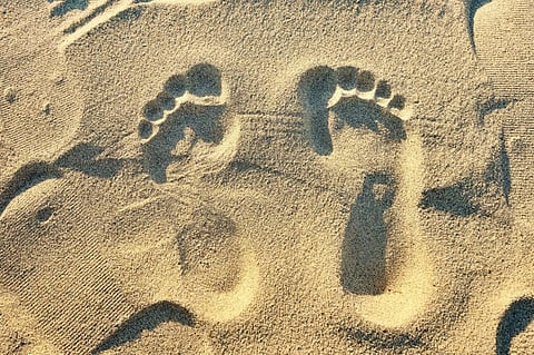 A casual stroll on the beach can leave enough intact DNA behind to extract identifiable information. Photo: Comezora/Moment via Getty Images