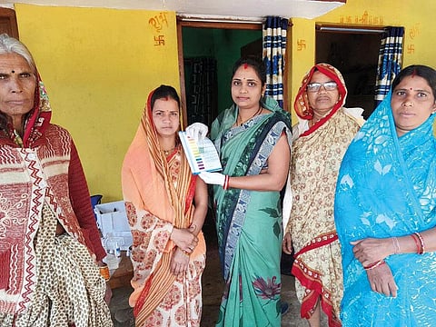 Anita Chaudhary (centre), head of the Garhmau village water and sanitation committee, with other members (Photograph: Ruby Sarkar)