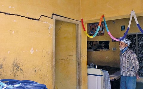 Almost all houses in Mohali’s Landarn village have developed cracks due to subsidence caused by incessant groundwater extraction for irrigation (Photograph: Pranshu Pranjal, Illustration: Yogendra Anand)