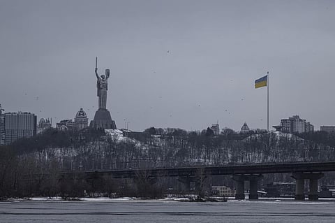 Kyiv and the Dnipro River on January 7, 2024. The river has frozen due to sub-zero temperatures. Seen in this photo from iStock are The Motherland (Sculpture), the Flag of Ukraine, and the Kievan district of Pechersk Lavra