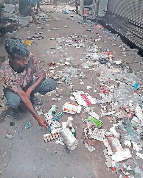 Discarded drugs litter the lanes of Bhagirath Palace, the largest wholesale market of drugs in the country (Photographs: Divya Khatter)