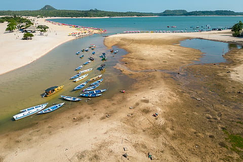 Small boats can be seen stranded in the nearly dry bed of the Tapajos river in Alter do Chao, Santarem, Brazil, during the Amazonian drought in 2023
