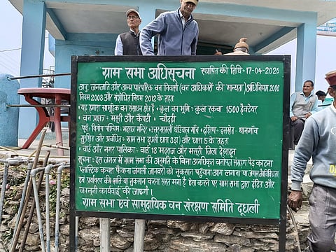 Villagers put up signboards marking the Dudhli Gram Sabha and the Community Forest Conservation Committee;