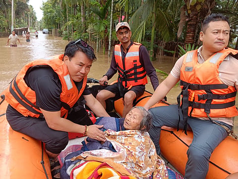 Rescue teams at work in flood-hit Assam, where 12 districts are inundated despite a 30% rainfall deficit this season.