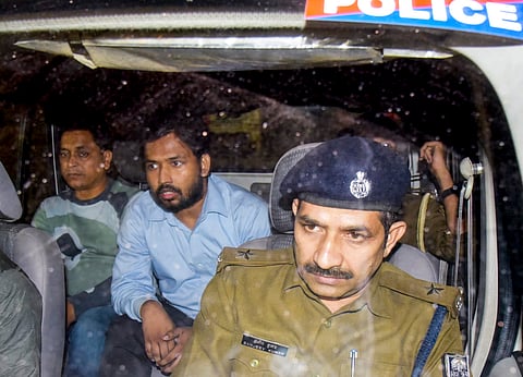 Tutor and YouTuber Khan Sir being detained after a protest on Friday