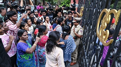 Students protest in front of Anna University gate