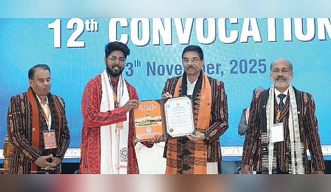 Governor Hari Babu Kambhampati presents a certificate to a student at the event. (Photo | Express)