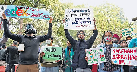 Residents stage a protest at Jantar Mantar on Tuesday criticising government for not tackling pollution crisis
