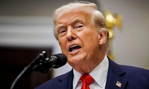 Trump signs AI order to curb state rules, warns China race at stake