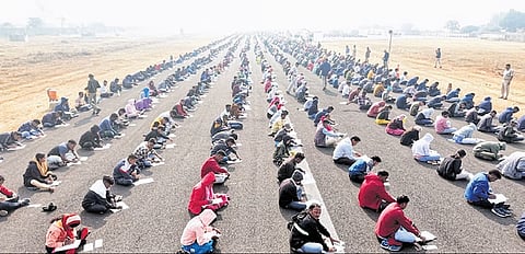 Aspirants for home guard posts taking the test at Jamadarpali airstrip