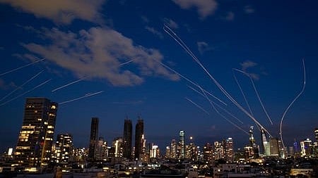 Missiles light up the night sky as conflict escalates