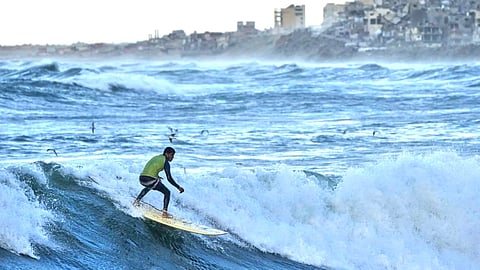 Amid Israeli onslaught, Gaza surfers embrace the sea for solace