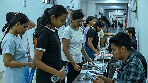 Candidates are going through the verification process before appearing for NEET exams at a higher secondary school in Rajasthan.