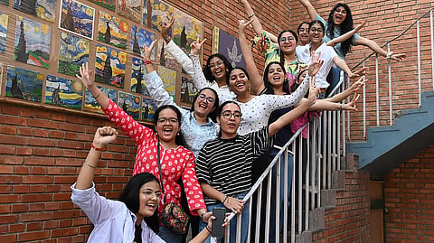 Students celebrate at St Thomas’ Girls Senior Secondary School, New Delhi after the CBSE Class 12 results were declared on Wednesday.