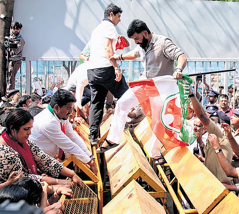 Karnataka Youth Congress chief Manjunath Gowda leads the party members during the protest against the NEET paper leak, in Bengaluru on Thursday.
