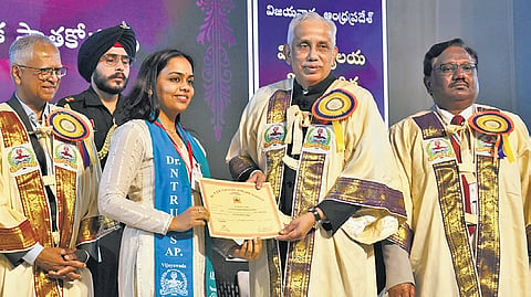 Governor S Abdul Nazeer presents a degree to a student at the 29th and 30th convocations of NTR Health University in Vijayawada on Tuesday.
