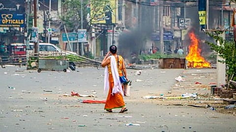 Imphal: Women walk across a deserted road after police disperse protesters with tear gas (Representational Image)