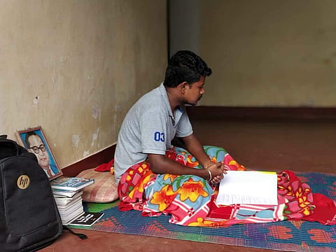 Mahesh Sosle, at the college hostel corridor after being evicted by the authorities