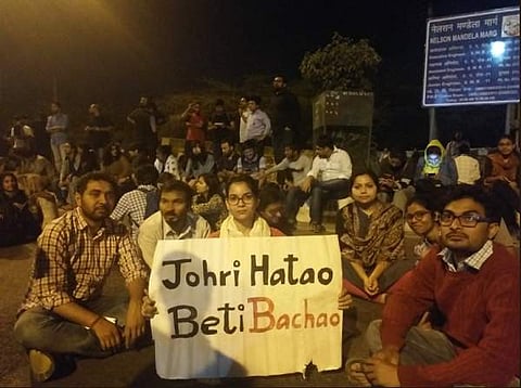 The students claim that the University is willfully shielding prof Atul Johri despite several FIRs having been filed against him