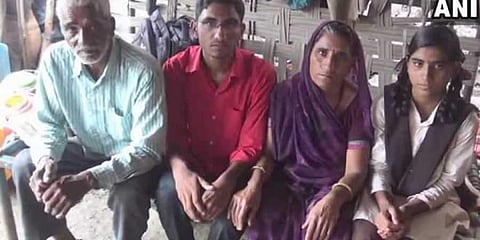 Asharam with his parents and sister