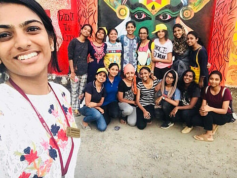 Team chayam's selfie with the graffiti