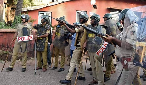 Policemen in Mangaluru preparing to open fire during violent protests on December 19 (Pic: Reuters)