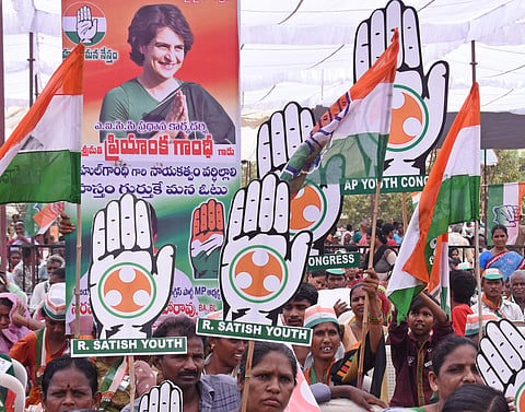 Supporters greet Congress President Rahul Gandhi during his election campaign in Vijaywada (Pic: Express)