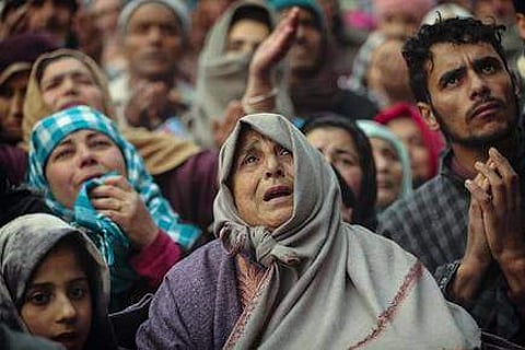 Kashmiri Muslim devotees offer prayer outside the shrine of Sufi saint Sheikh Syed Abdul Qadir Jeelani in Srinagar, Dec 9, 2019. (Pic: Mukhtar Khan)