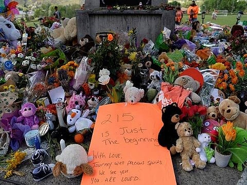 File photo of tributes paid at unmarked graves found at an Indigenous school in Canada | Pic: ANI