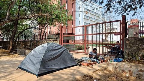 SAU student camps outside main gate after eviction from hostel | (Pic: Apoorva YK)